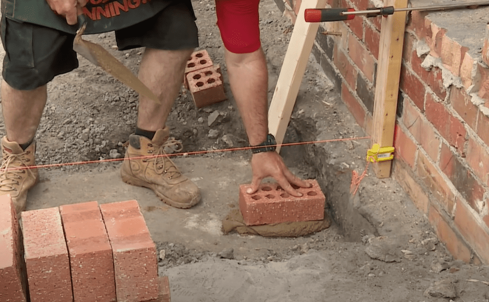 Lay the first row of brick veneers